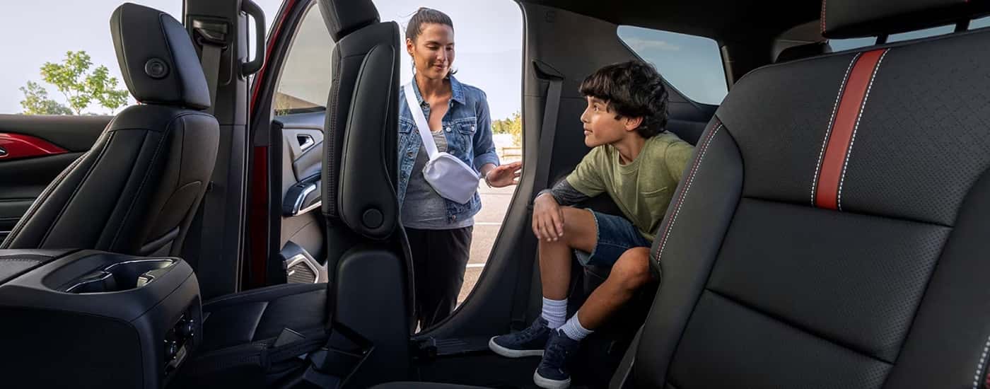 Child getting into a 2026 Chevy Traverse RS