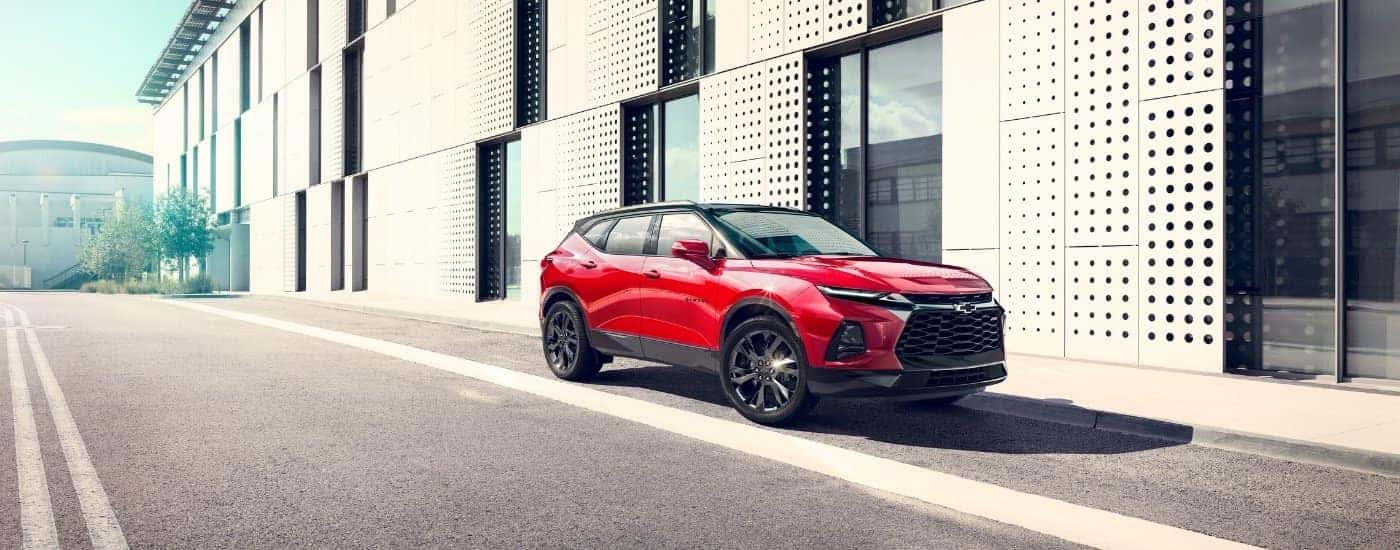 A red 2023 Chevy Blazer from the side.