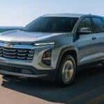 A silver 2026 Chevy Equinox driving on a highway.