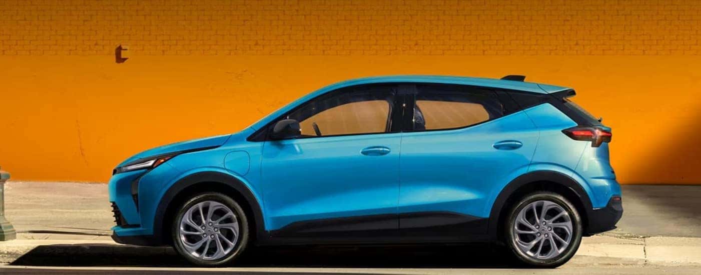 A parked blue 2027 Chevy Bolt.
