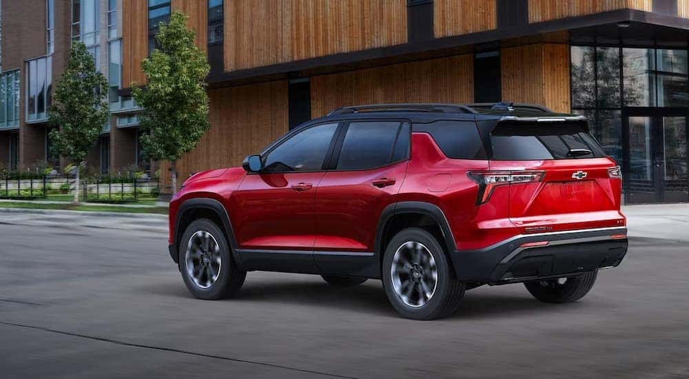 Red 2026 Chevy Equinox driving through a city