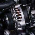 An alternator placed inside of an engine.