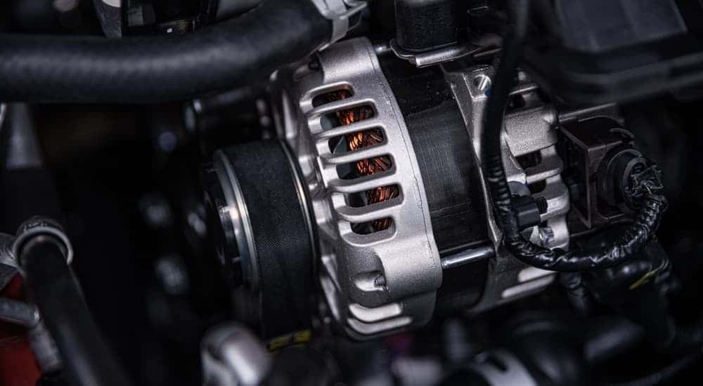 An alternator placed inside of an engine.