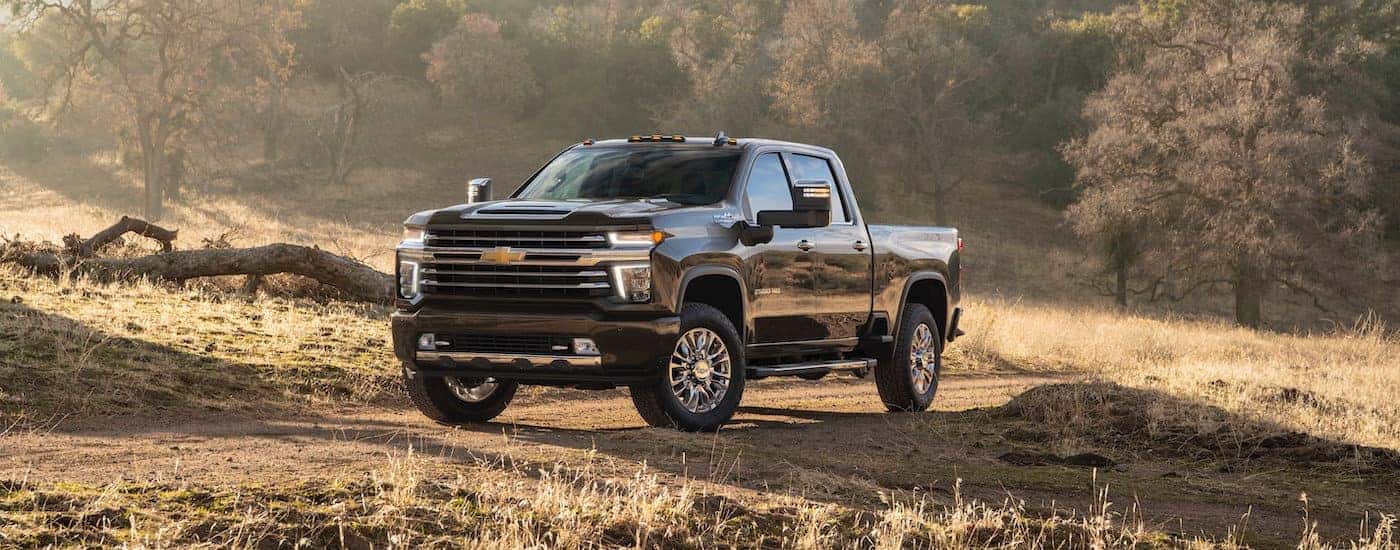 Black 2020 Chevy Silverado 2500 HD parked in a field