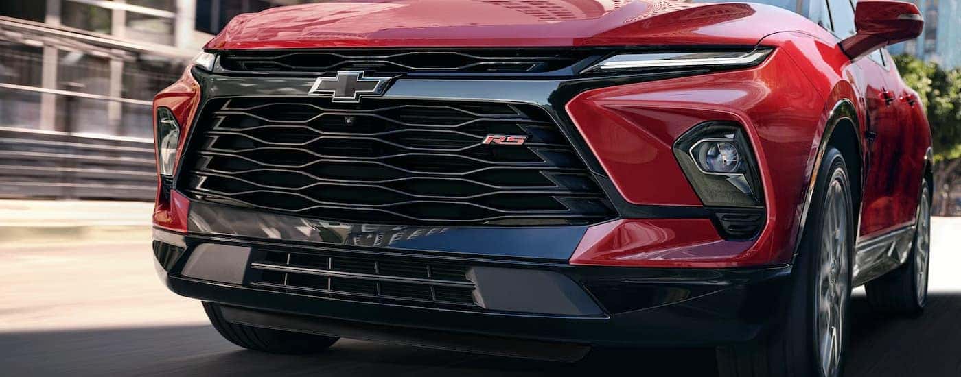 Grille and front of a red 2026 Chevy Blazer RS