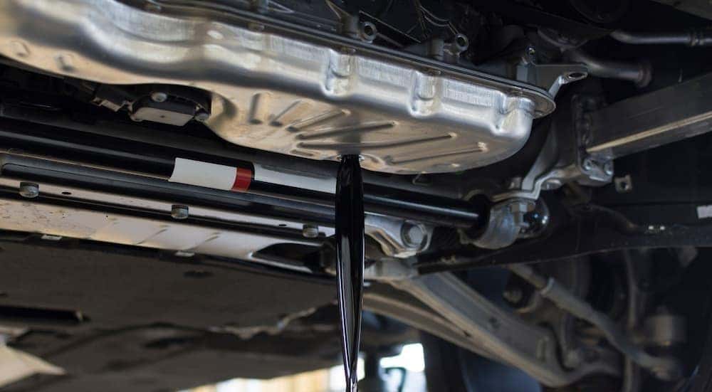 Oil being drained from a vehicle.
