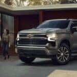 Silver 2026 Chevy Silverado 1500 backed into a driveway