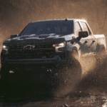 Blue 2026 Chevy Silverado 1500 Z71 drifting through mud
