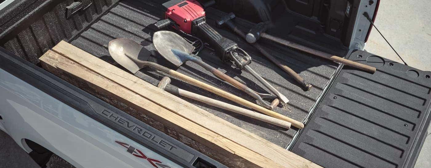 Tools in the bed of a 2026 Chevy Silverado 1500.