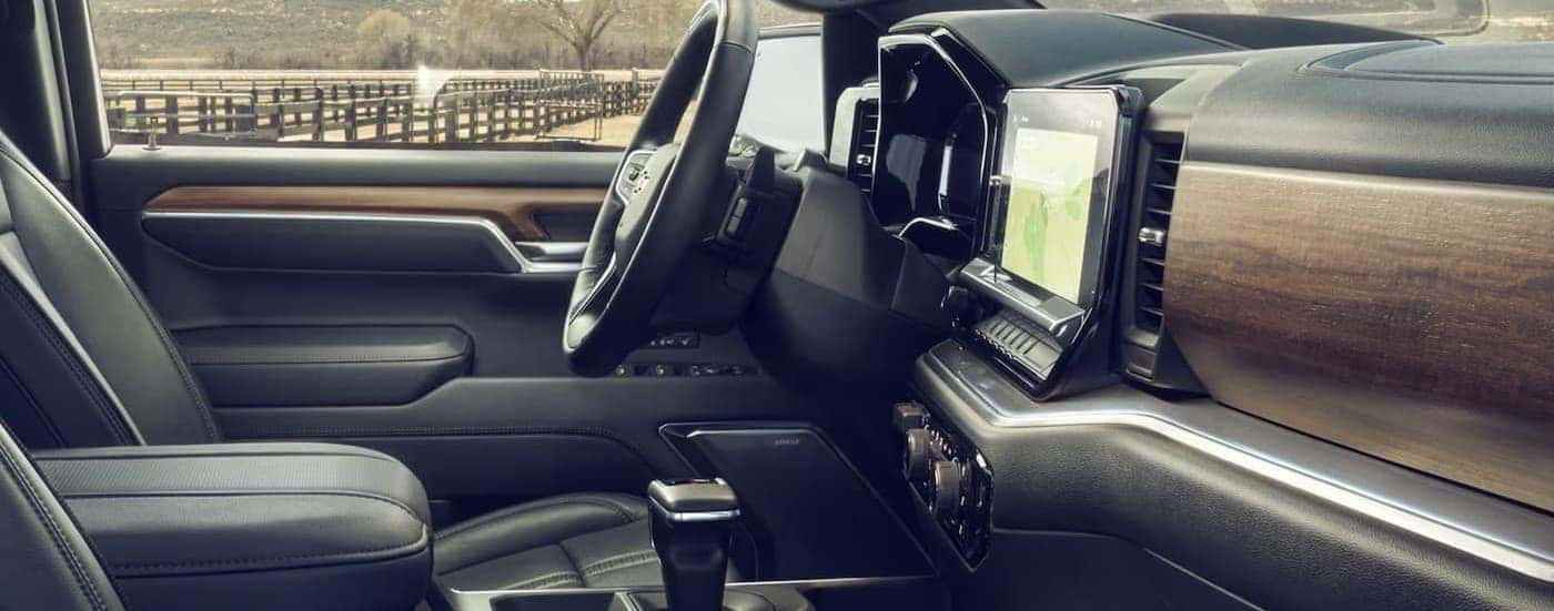 Gray and wood interior in a 2026 Chevy Silverado 1500.