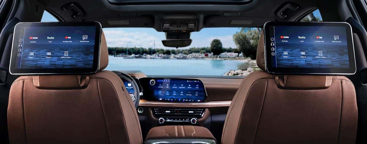 Brown interior and infotainment monitors in a 2026 Chevy Suburban.