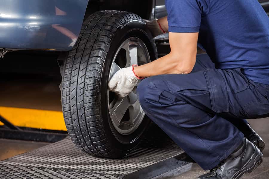 image of man changing a tire