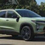 A green 2026 Chevy Trax ACTIV parked on pavement.