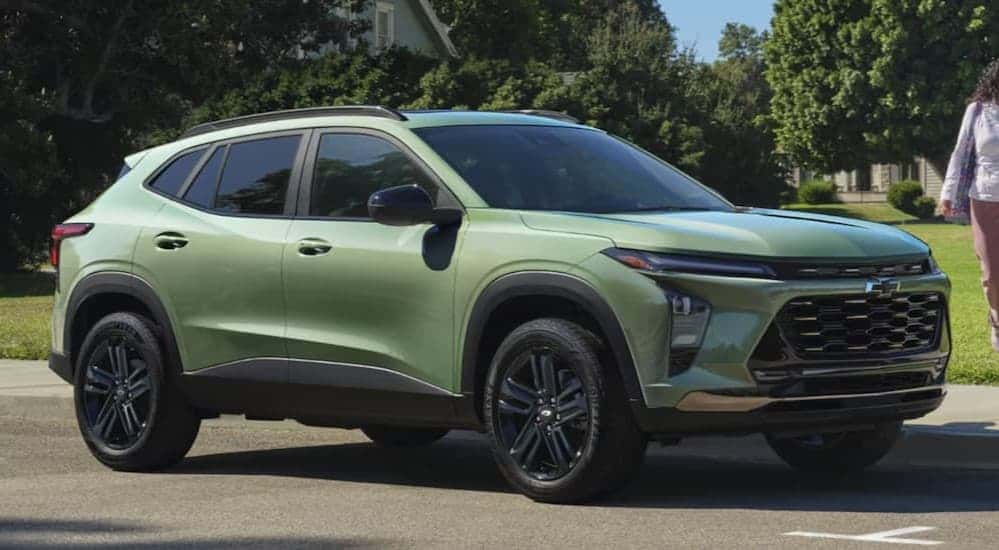 A green 2026 Chevy Trax ACTIV parked on pavement.
