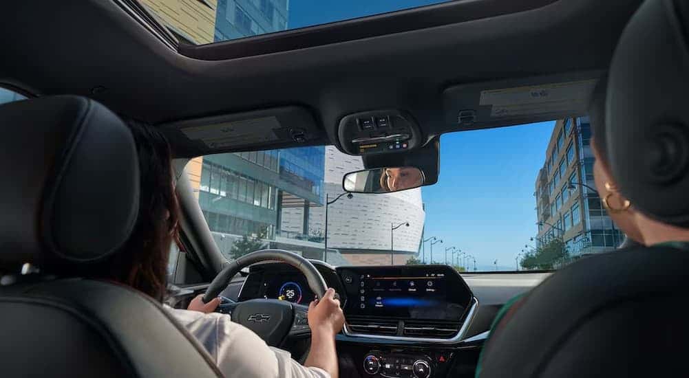 A person driving in a 2026 Chevy Trax ACTIV.