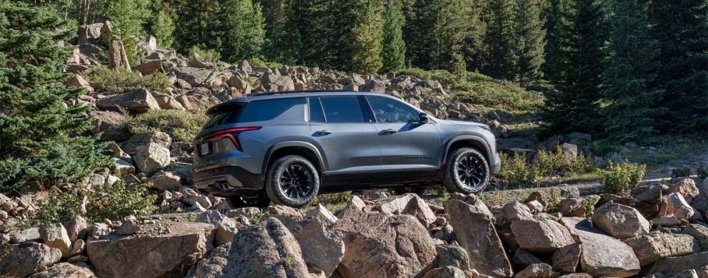 Silver 2025 Chevy Traverse Z71 driving up a trail