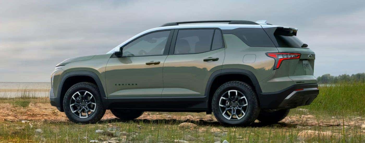 Green 2026 Chevy Equinox parked near water