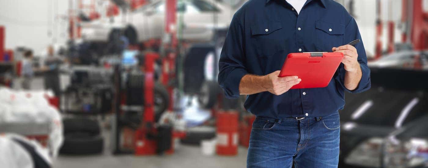 A service technician holding a clipboard