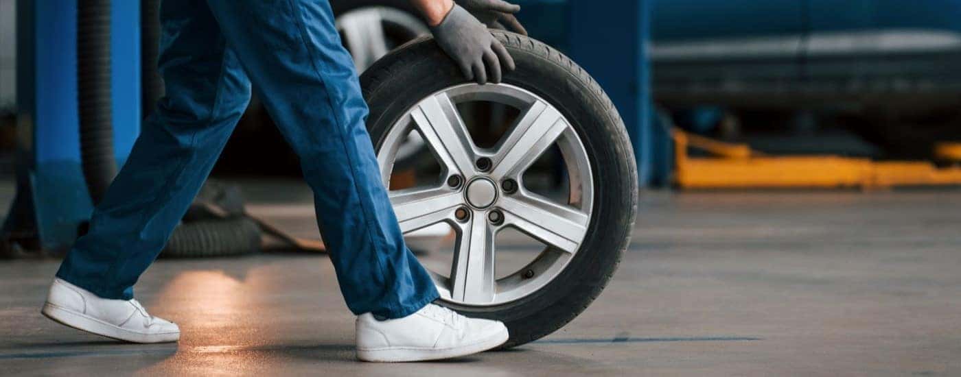 A tire being rolled across the floor