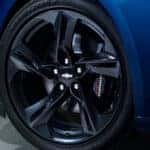 Close up of a blue 2020 Chevy Camaro tire and wheel.