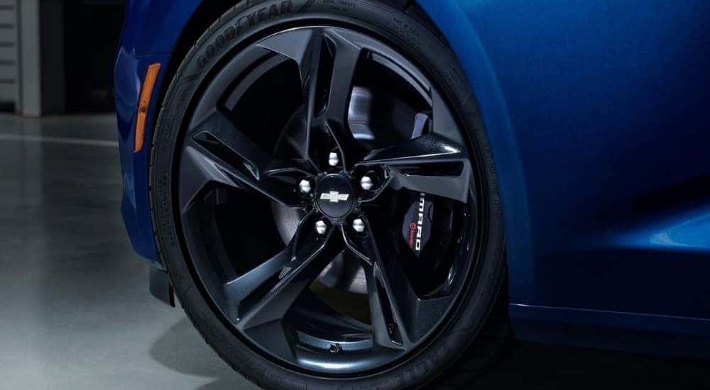 Close up of a blue 2020 Chevy Camaro tire and wheel.