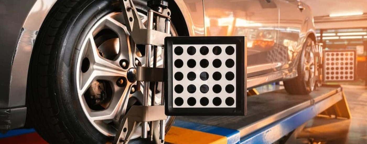 Wheel alignment equipment on a vehicle.
