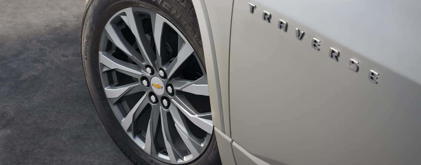 Wheel and tire on a white 2022 Chevy Traverse.