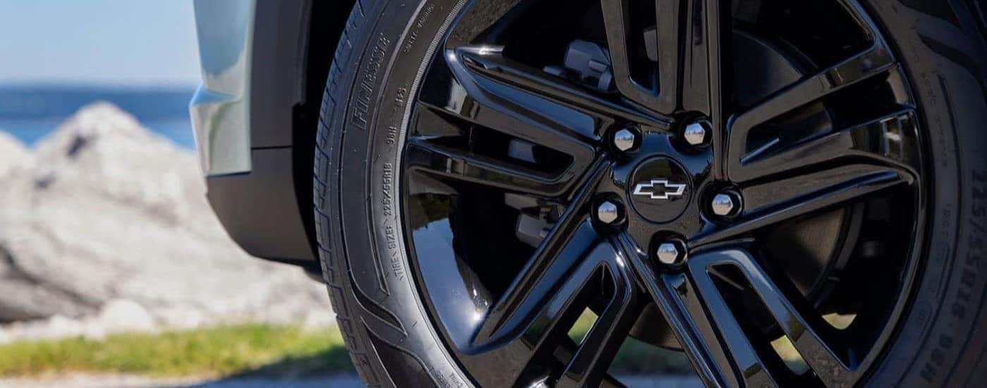 Close up of the tire and rims on a 2024 Chevy Trax ACTIV.