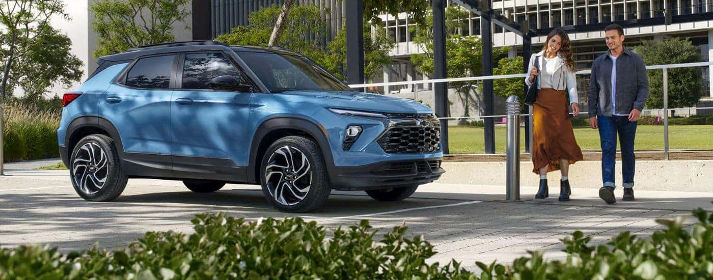 Blue 2026 Chevy Trailblazer with a couple walking to it