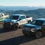 A green, white and black 2027 Silverado Trio parked.
