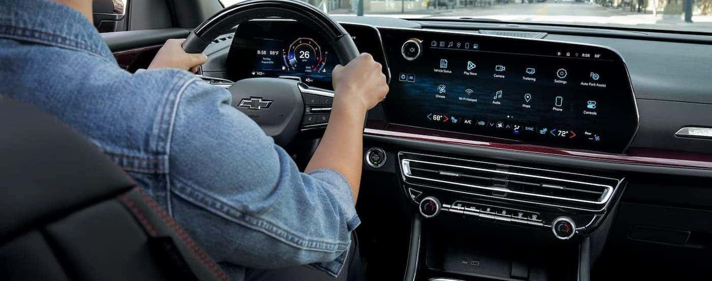 A person driving a 2026 Chevy Traverse.