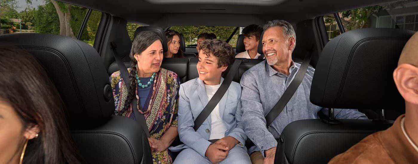 Several passengers sitting in a 2026 Chevy Traverse.