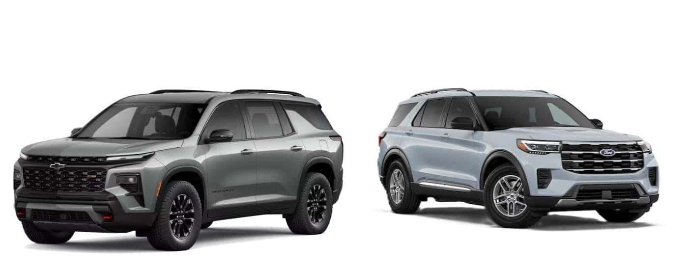 A silver 2026 Chevy Traverse vs a light blue 2026 Ford Explorer.