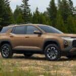 A brown 2027 Chevy Equinox parked offroad.
