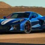 A blue 2027 Chevy Corvette Grand Sport 3LT Coupe parked on a track.