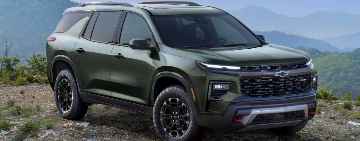 A green 2027 Chevy Traverse Z71 parked off-road.