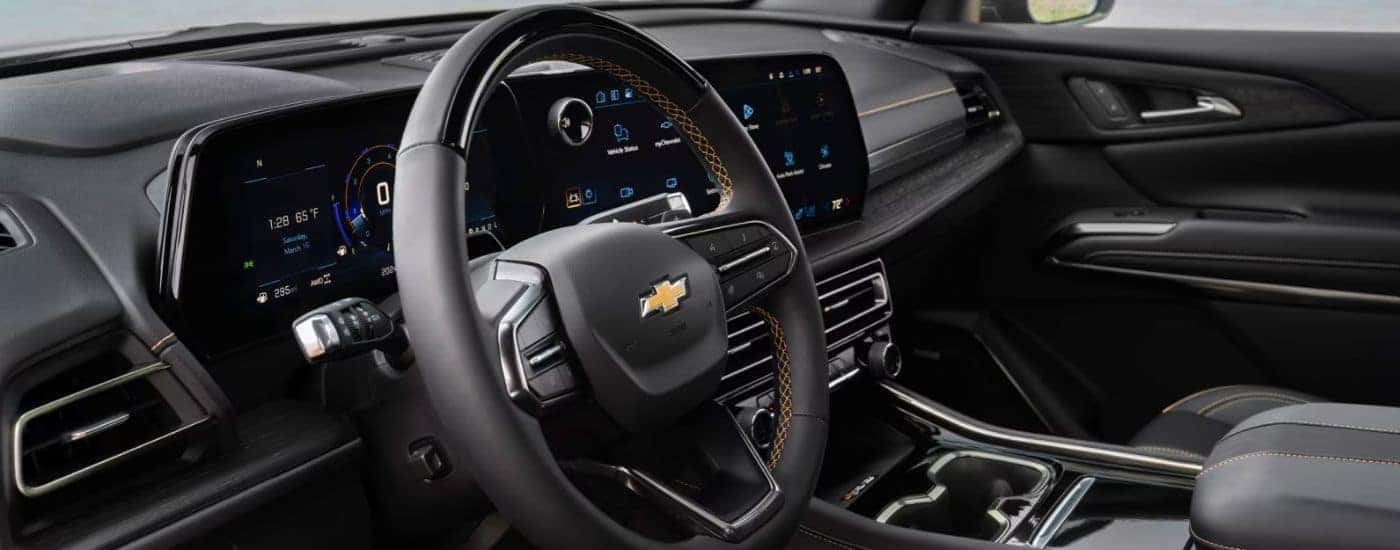 Steering wheel and infotainment display in a 2027 Chevy Traverse.