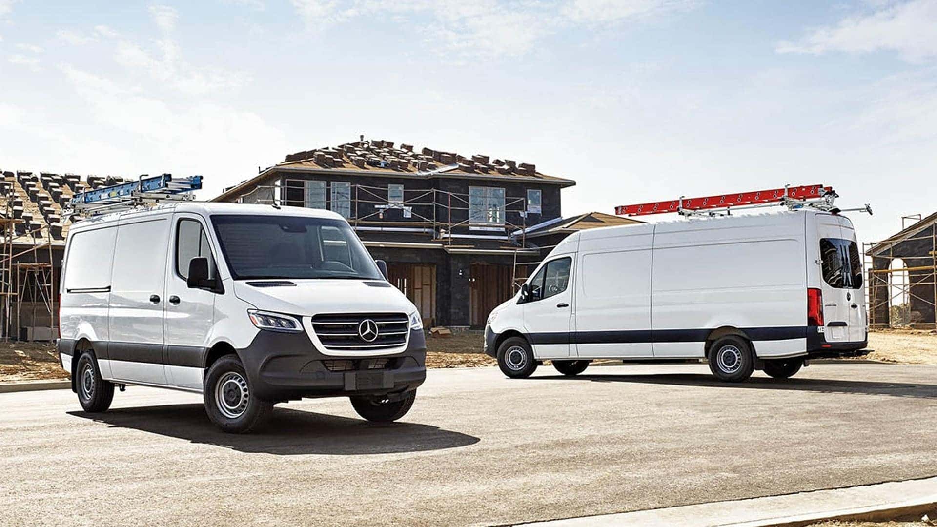 two 2025 sprinter vans parked outside