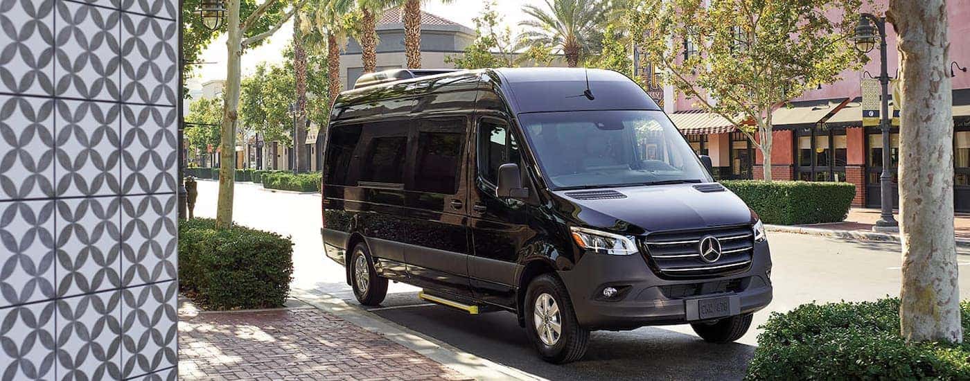 Black 2026 Mercedes-Benz Sprinter Van parked by a curb.