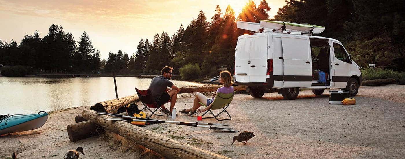White 2026 Mercedes-Benz Sprinter Van parked off-road near a lake.