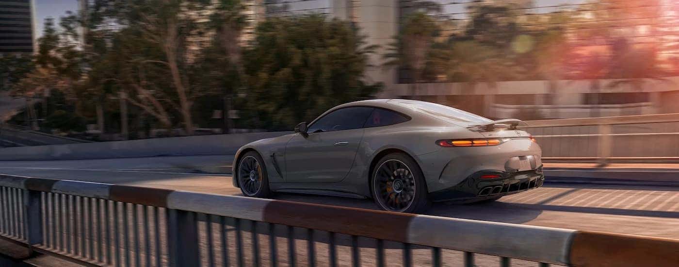 A grey Mercedes-Benz AMG GT from the side.