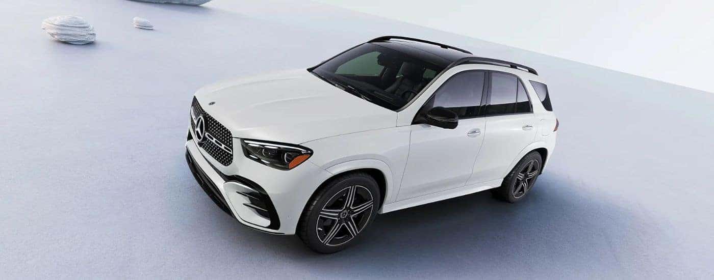 White 2026 Mercedes-Benz GLE against a white and gray background.