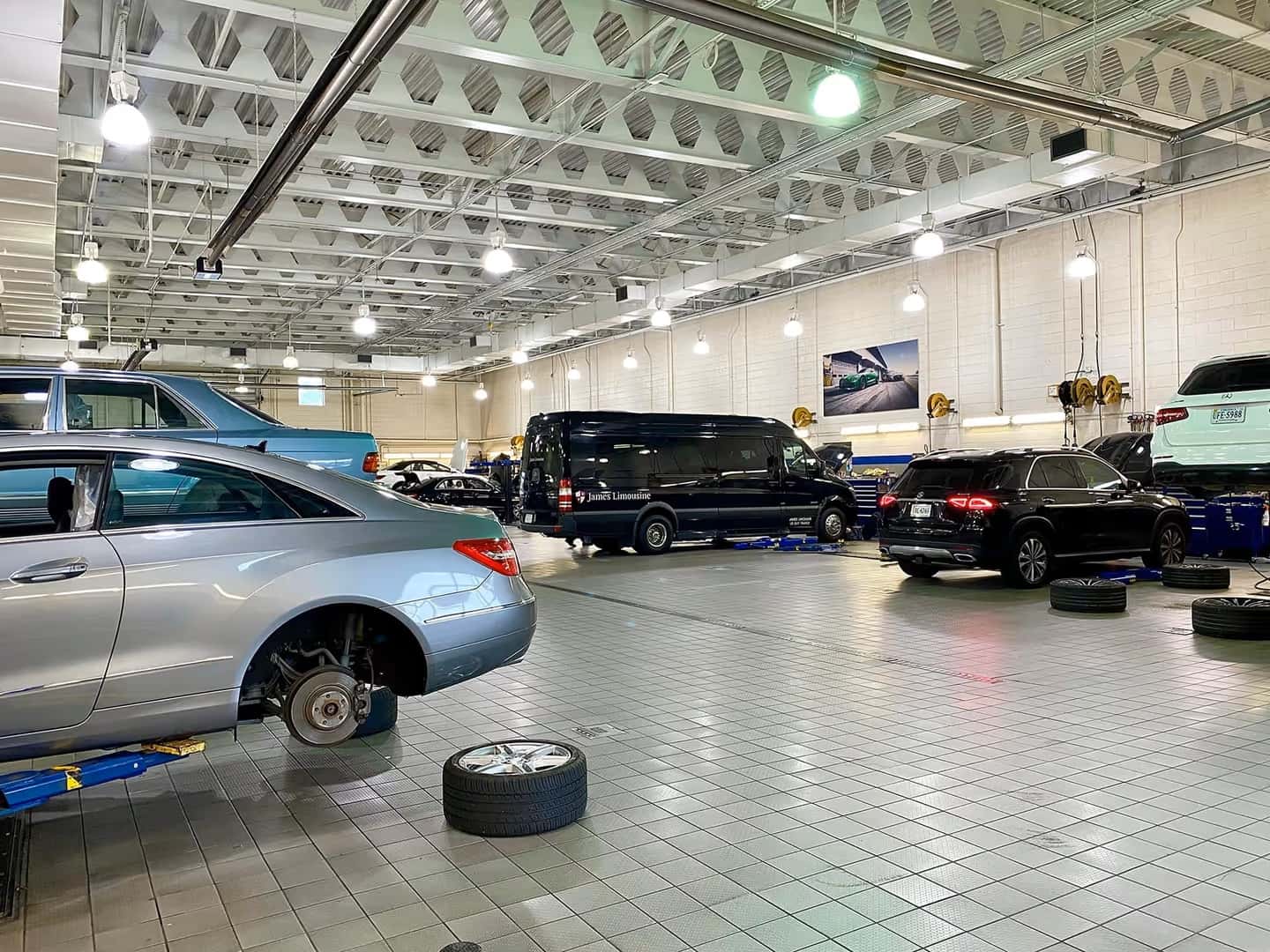 Mercedes-Benz vehicles on lifts in the service workshop at Mercedes-Benz of Midlothian