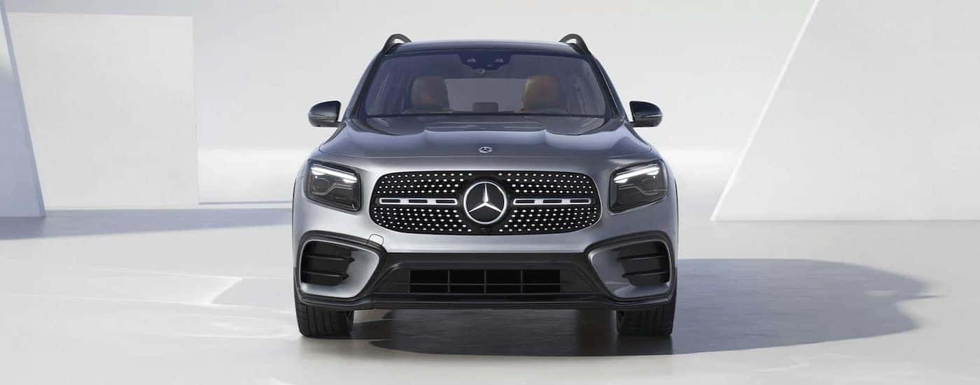 Grey 2026 Mercedes-Benz GLB SUV parked near a white wall