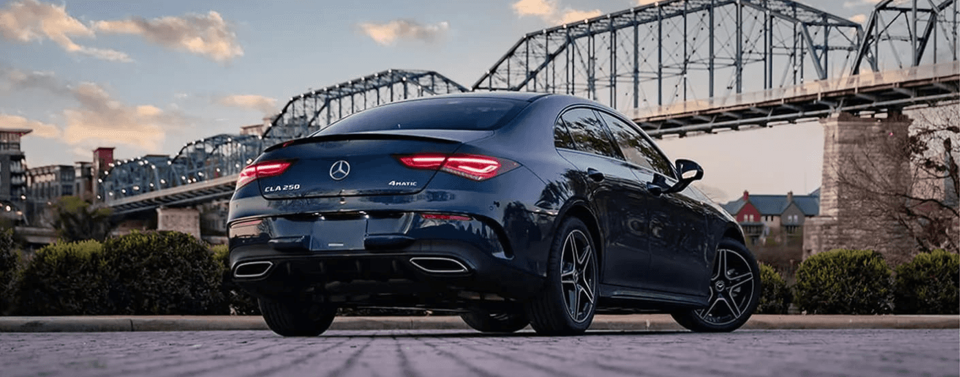 Black 2023 Mercedes-Benz CLA parked by a bridge