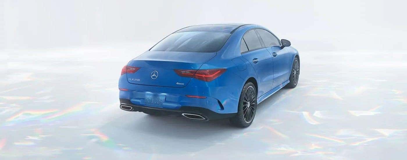 A blue 2025 Mercedes-Benz CLA from the rear.
