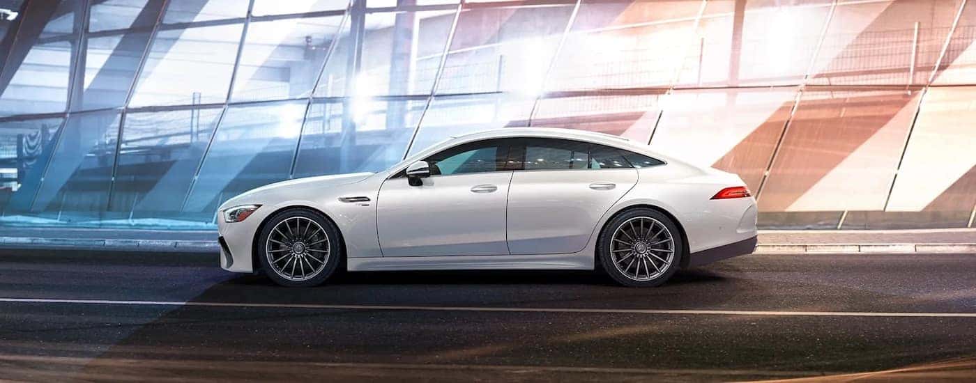 A white 2024 Mercedes-Benz AMG GT from the side.