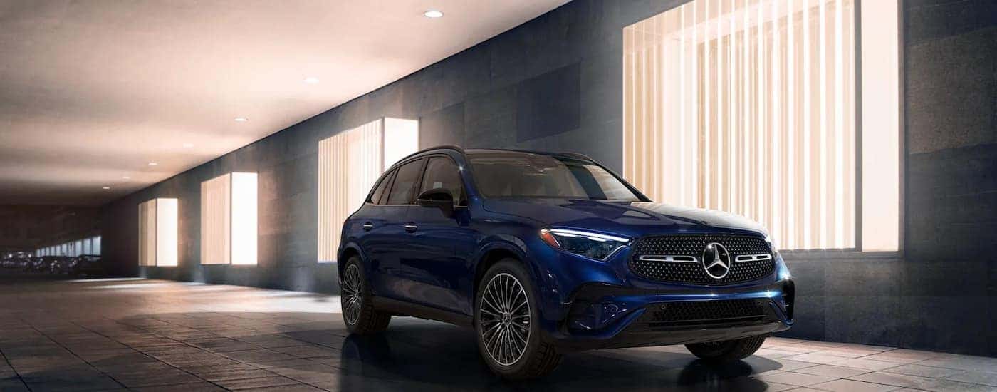 Dark blue 2026 Mercedes-Benz GLC 300 driving down a tunnel.
