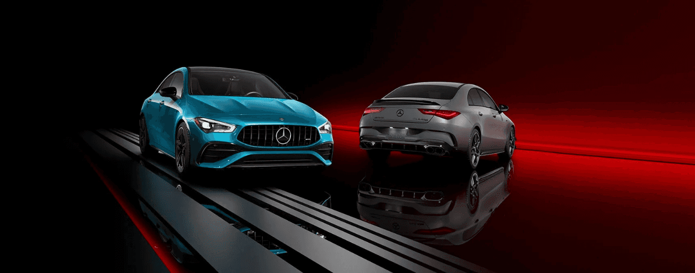 A blue and a grey 2026 Mercedes-Benz CLA AMG parked side by side