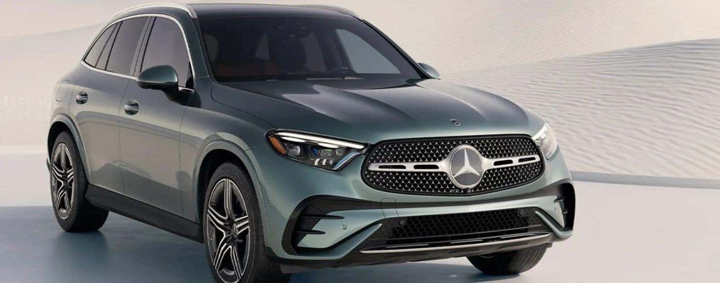Green 2026 Mercedes-Benz GLC parked against white sand dunes